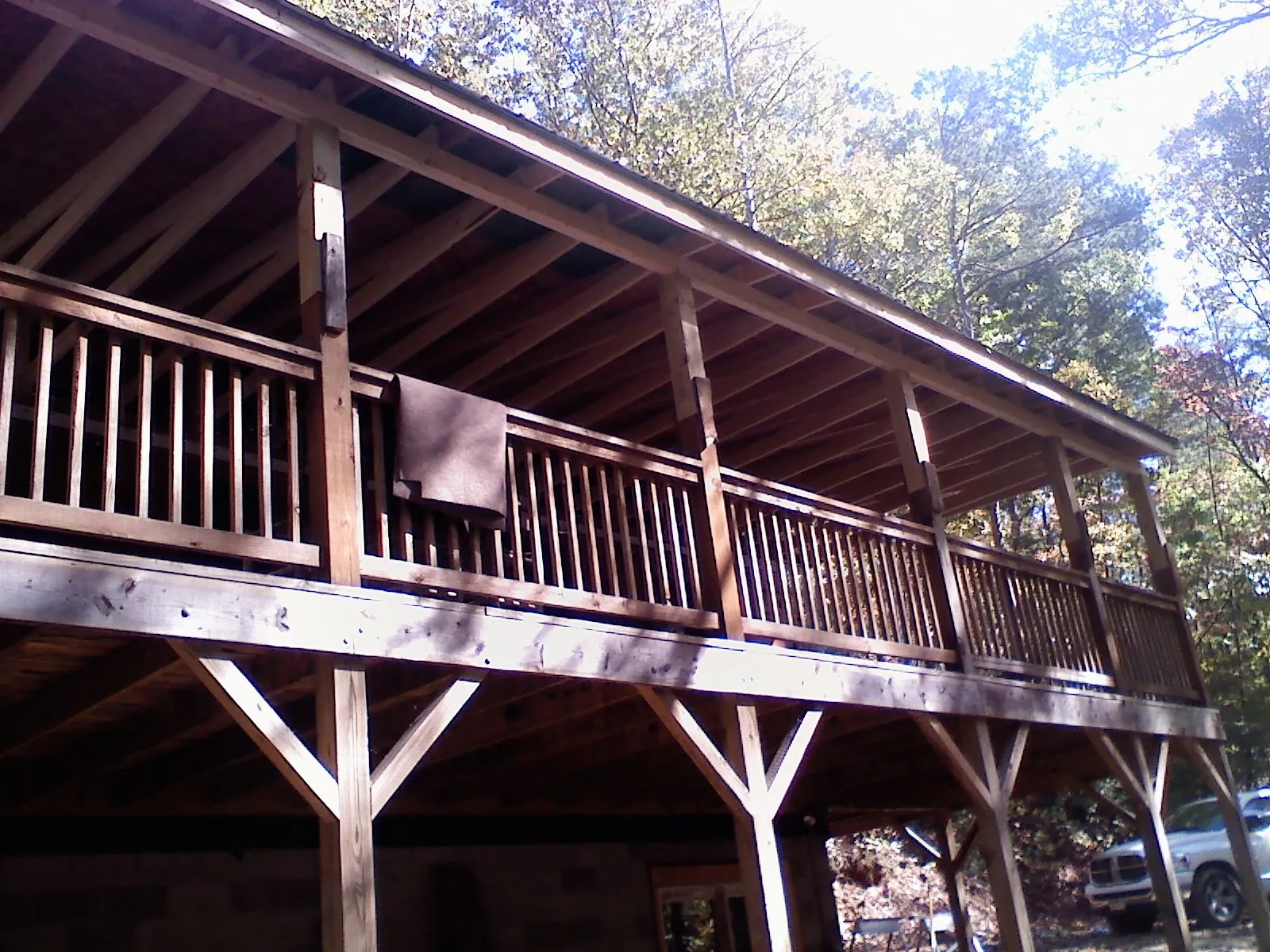 Timber framing under a new elevated porch and deck — Roof Leak Repair in Newfield by Roofing Brothers